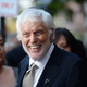 Actor Dick Van Dyke smiling, in a suit and tie, in 2019.
